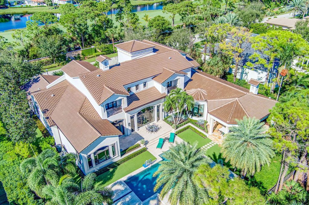 Stunning $14.5 Million Custom Estate in The Bears Club Jupiter with Lavish Amenities and Resort-Style Living