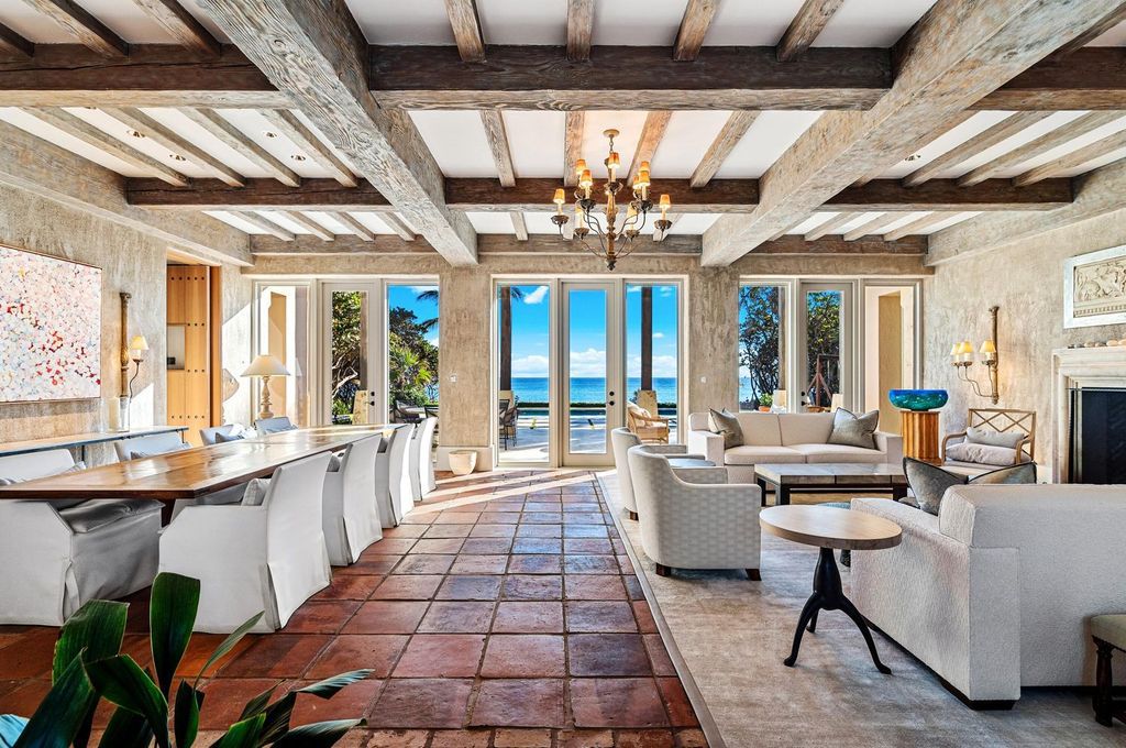 This stunning 8-bedroom, 9-bathroom estate spans 9,855 square feet and evokes the charm of Lake Como’s iconic villas. Designed by John Saladino, it blends rustic sophistication with grand elegance, featuring hand-hewn wood beams, reclaimed terra cotta floors, plaster walls, and a Tejas Borja tile roof.