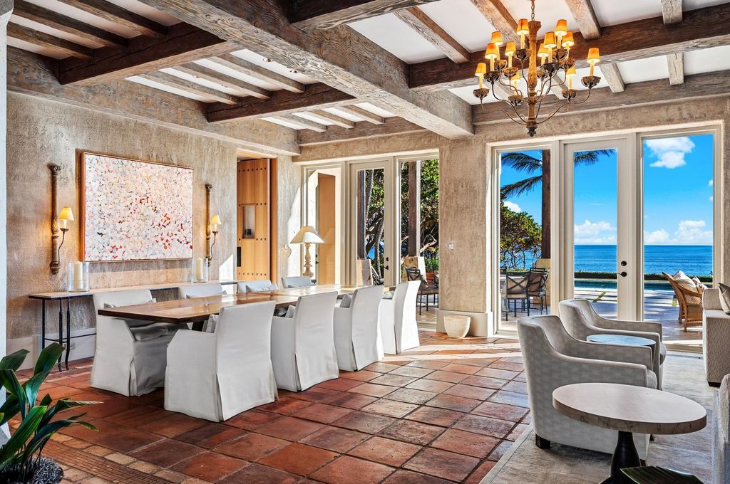 This stunning 8-bedroom, 9-bathroom estate spans 9,855 square feet and evokes the charm of Lake Como’s iconic villas. Designed by John Saladino, it blends rustic sophistication with grand elegance, featuring hand-hewn wood beams, reclaimed terra cotta floors, plaster walls, and a Tejas Borja tile roof.