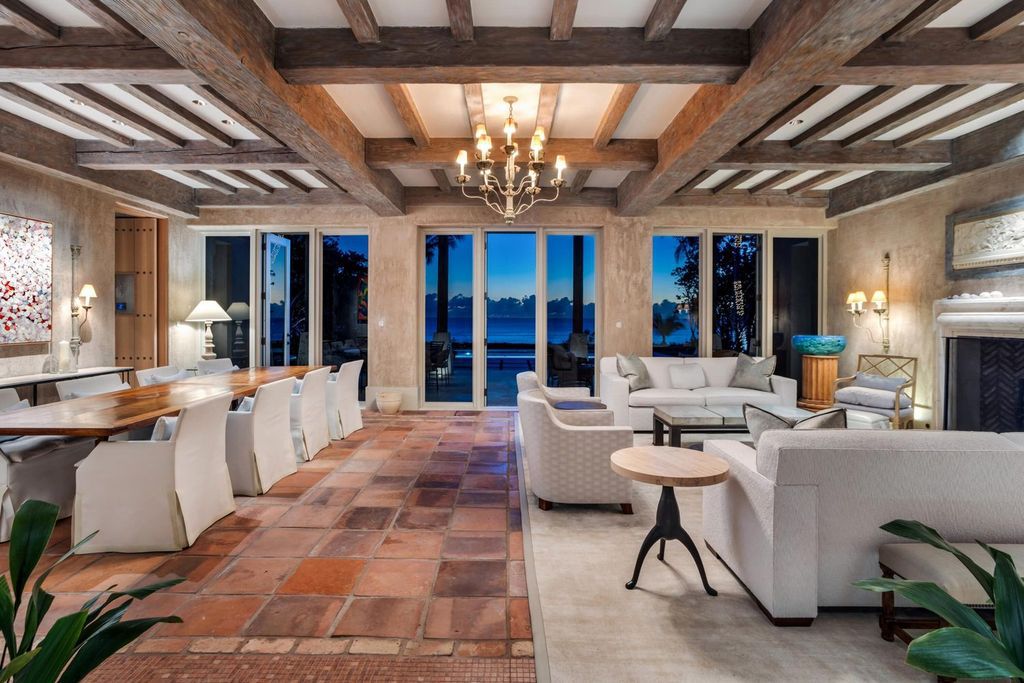 This stunning 8-bedroom, 9-bathroom estate spans 9,855 square feet and evokes the charm of Lake Como’s iconic villas. Designed by John Saladino, it blends rustic sophistication with grand elegance, featuring hand-hewn wood beams, reclaimed terra cotta floors, plaster walls, and a Tejas Borja tile roof.