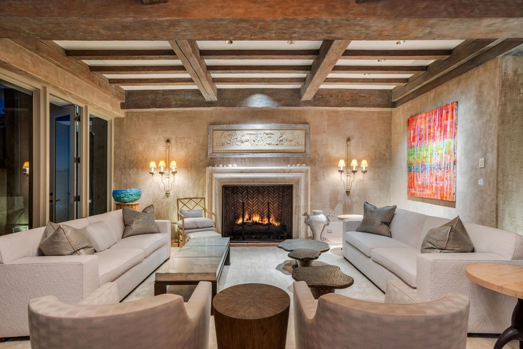 This stunning 8-bedroom, 9-bathroom estate spans 9,855 square feet and evokes the charm of Lake Como’s iconic villas. Designed by John Saladino, it blends rustic sophistication with grand elegance, featuring hand-hewn wood beams, reclaimed terra cotta floors, plaster walls, and a Tejas Borja tile roof.