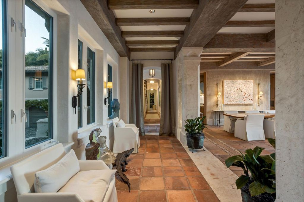 This stunning 8-bedroom, 9-bathroom estate spans 9,855 square feet and evokes the charm of Lake Como’s iconic villas. Designed by John Saladino, it blends rustic sophistication with grand elegance, featuring hand-hewn wood beams, reclaimed terra cotta floors, plaster walls, and a Tejas Borja tile roof.