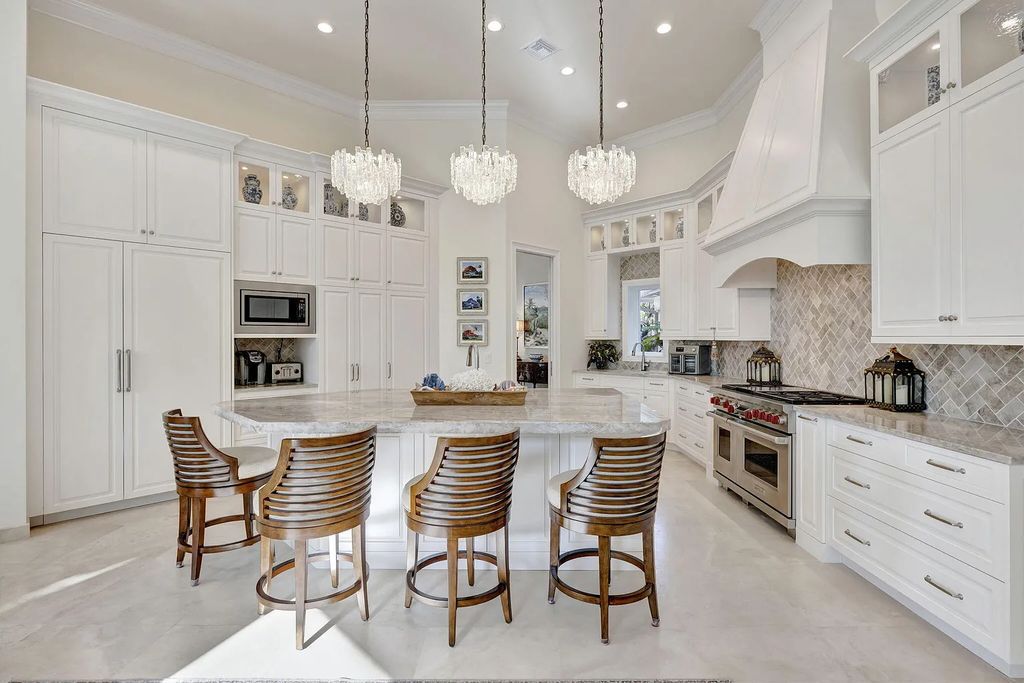 Discover unparalleled luxury at 2995 SE Dune Drive, Stuart, FL, an exquisite Sailfish Point estate located on the renowned Jack Nicklaus 'Signature' golf course and just steps from the ocean.