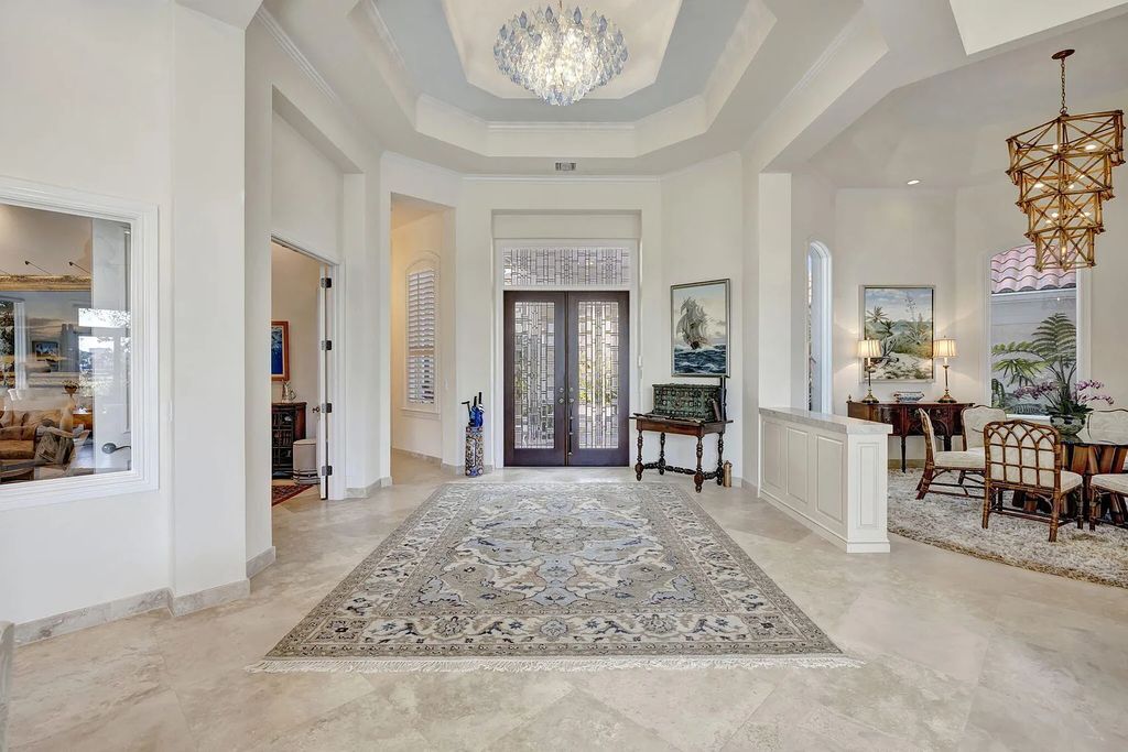 Discover unparalleled luxury at 2995 SE Dune Drive, Stuart, FL, an exquisite Sailfish Point estate located on the renowned Jack Nicklaus 'Signature' golf course and just steps from the ocean.