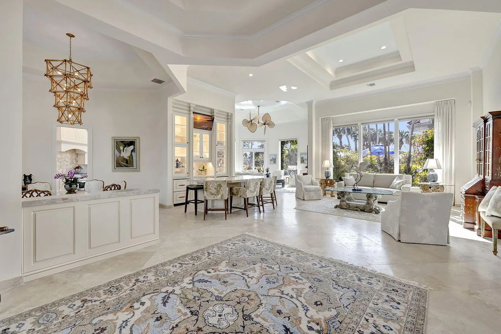 Discover unparalleled luxury at 2995 SE Dune Drive, Stuart, FL, an exquisite Sailfish Point estate located on the renowned Jack Nicklaus 'Signature' golf course and just steps from the ocean.