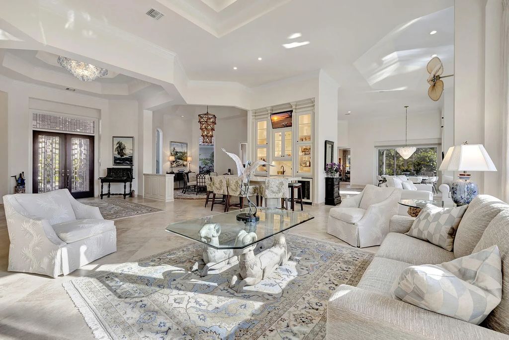 Discover unparalleled luxury at 2995 SE Dune Drive, Stuart, FL, an exquisite Sailfish Point estate located on the renowned Jack Nicklaus 'Signature' golf course and just steps from the ocean.