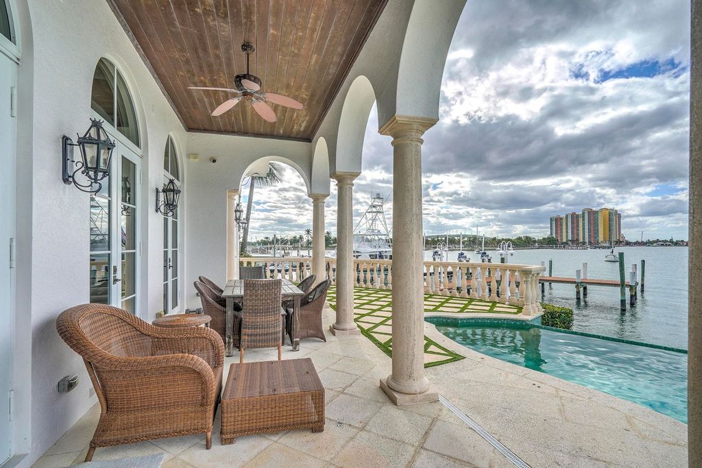 Designed with an open Mediterranean-inspired layout, this 4,034 square feet residence features an office, den, and expansive water views from every room. With 150 feet of waterfront, a 40,000-pound boat lift, and additional space for larger boats and jet skis, it’s a boater’s dream.