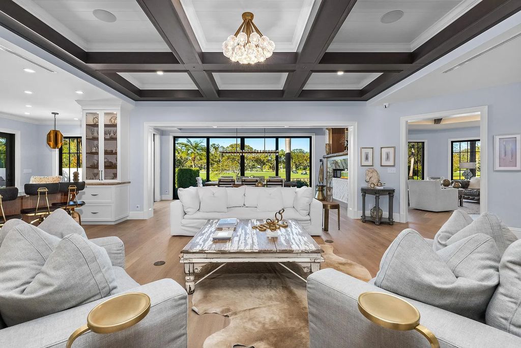 The 3-bedroom main residence features exquisite finishes, including chevron-patterned white oak floors, a striking octagonal living room, and a chef’s kitchen with dual walnut islands, Taj Mahal quartzite countertops, and Viking appliances.