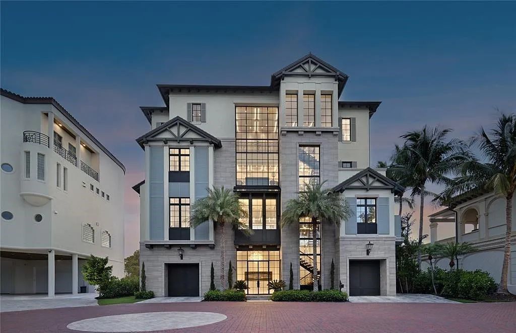 Nestled in the exclusive Strand at Bay Colony, this newly constructed 2023 custom home offers 5 bedrooms, 6 baths, and 7,210 square feet of refined living space on a 0.60-acre beachfront lot.