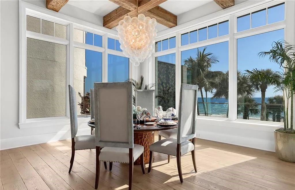 Nestled in the exclusive Strand at Bay Colony, this newly constructed 2023 custom home offers 5 bedrooms, 6 baths, and 7,210 square feet of refined living space on a 0.60-acre beachfront lot.