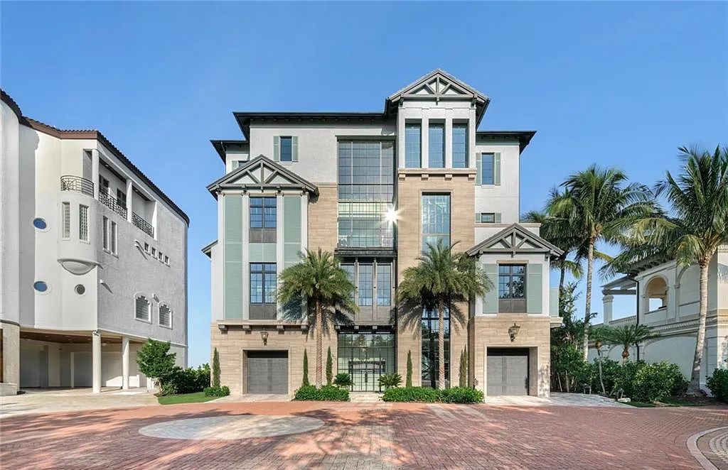 Nestled in the exclusive Strand at Bay Colony, this newly constructed 2023 custom home offers 5 bedrooms, 6 baths, and 7,210 square feet of refined living space on a 0.60-acre beachfront lot.