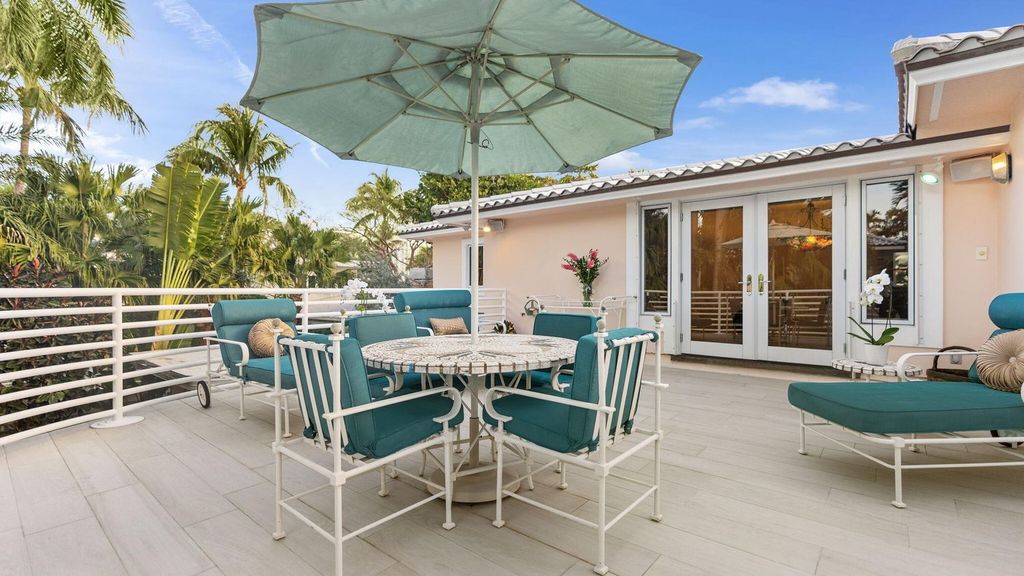 Located at 615 Idlewyld Drive, Fort Lauderdale, this exquisite 5-bedroom, 7-bathroom estate offers 6,037 square feet of refined living on a 0.54-acre waterfront lot. Built in 1939, it blends classic charm with modern elegance, featuring spacious living areas, a gourmet kitchen, and stunning water views. Outdoor highlights include a private pool, lush landscaping, and direct water access.