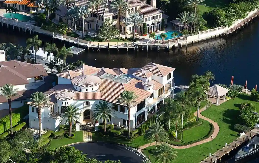 775 Oriole Circle, a $9.95M luxurious waterfront estate in Boca Raton, featuring an infinity pool, private dock, and breathtaking Intracoastal views in The Sanctuary.