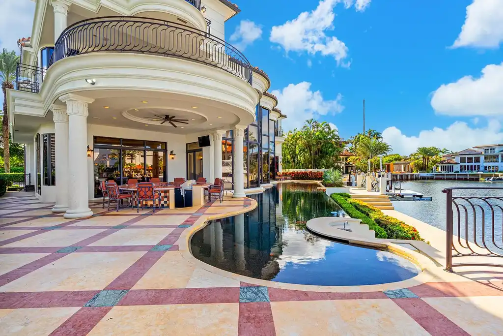 775 Oriole Circle, a $9.95M luxurious waterfront estate in Boca Raton, featuring an infinity pool, private dock, and breathtaking Intracoastal views in The Sanctuary.