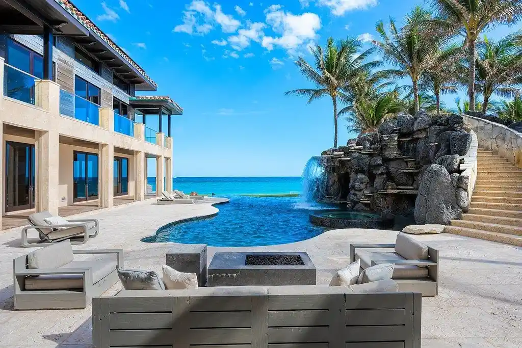 Expansive Balinese-inspired mansion at 1370 S Ocean Boulevard, Manalapan, offering world-class resort-style living and direct Intracoastal access.