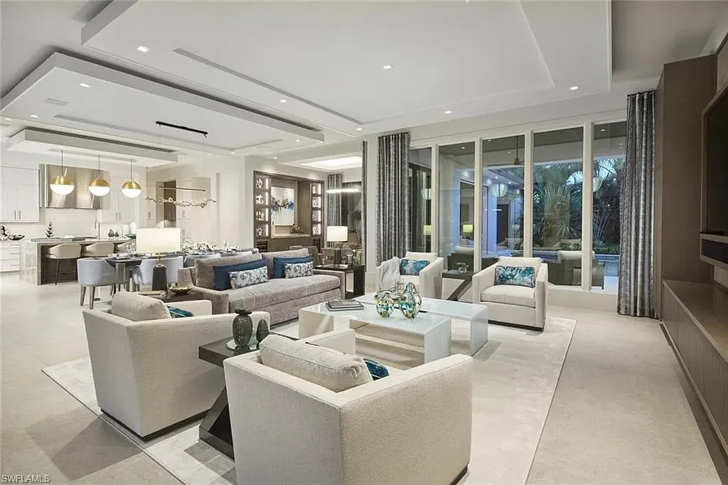 Spacious and elegantly designed living room at 2021 E Gordon Dr, Naples, with high ceilings, luxury finishes, and seamless indoor-outdoor living.