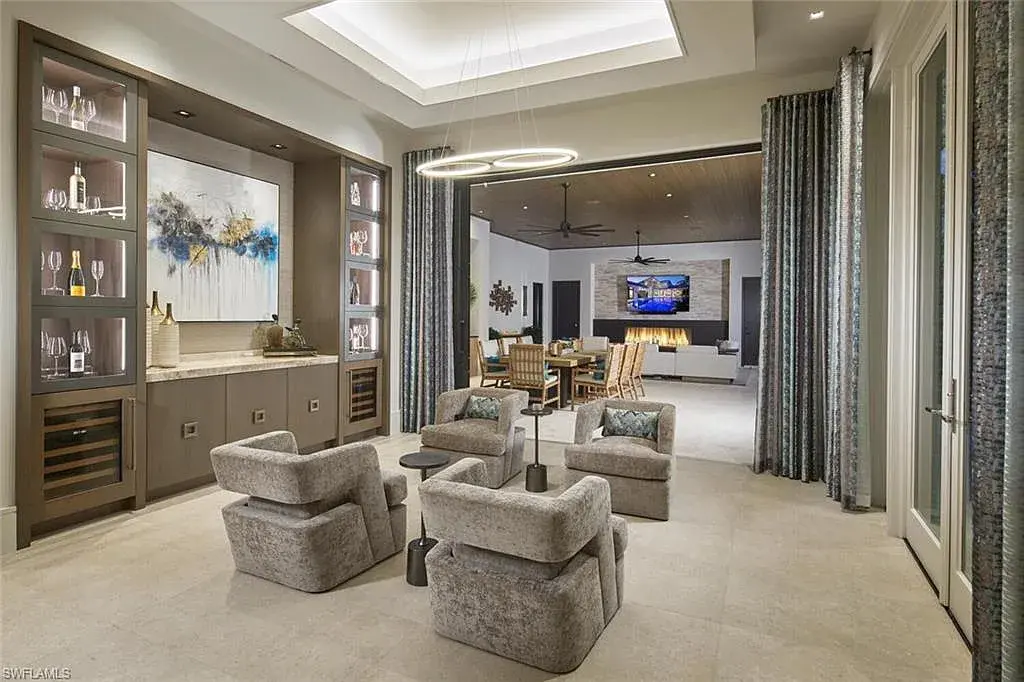 Spacious and elegantly designed living room at 2021 E Gordon Dr, Naples, with high ceilings, luxury finishes, and seamless indoor-outdoor living.