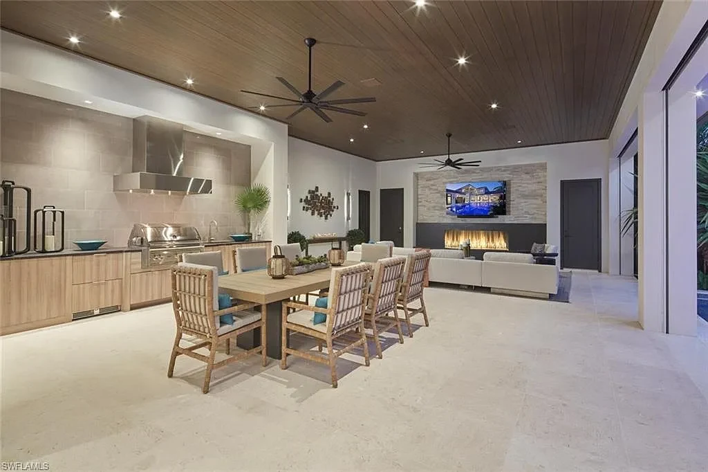 Spacious and elegantly designed living room at 2021 E Gordon Dr, Naples, with high ceilings, luxury finishes, and seamless indoor-outdoor living.