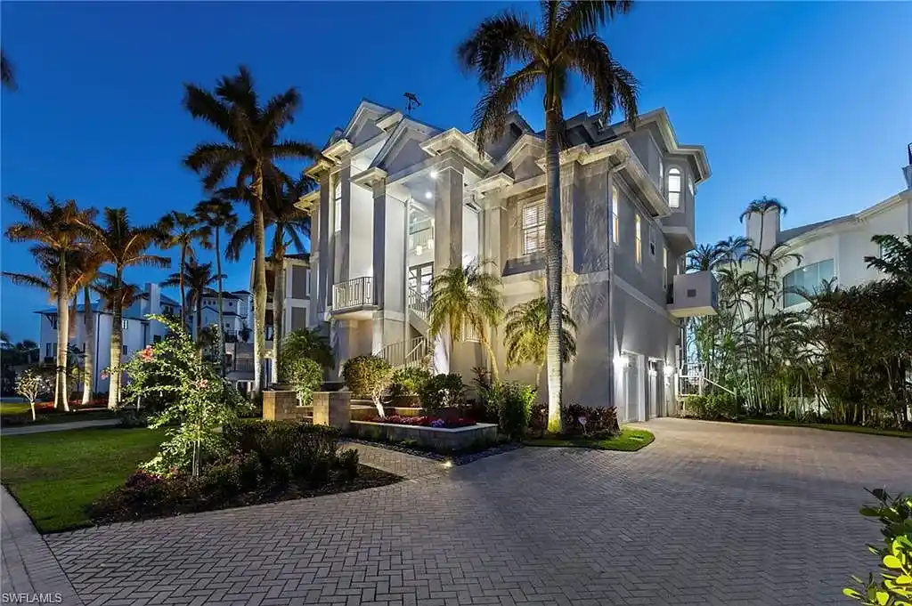 Spacious great room at 215 Barefoot Beach Blvd – High ceilings, floor-to-ceiling windows, and seamless indoor-outdoor living.