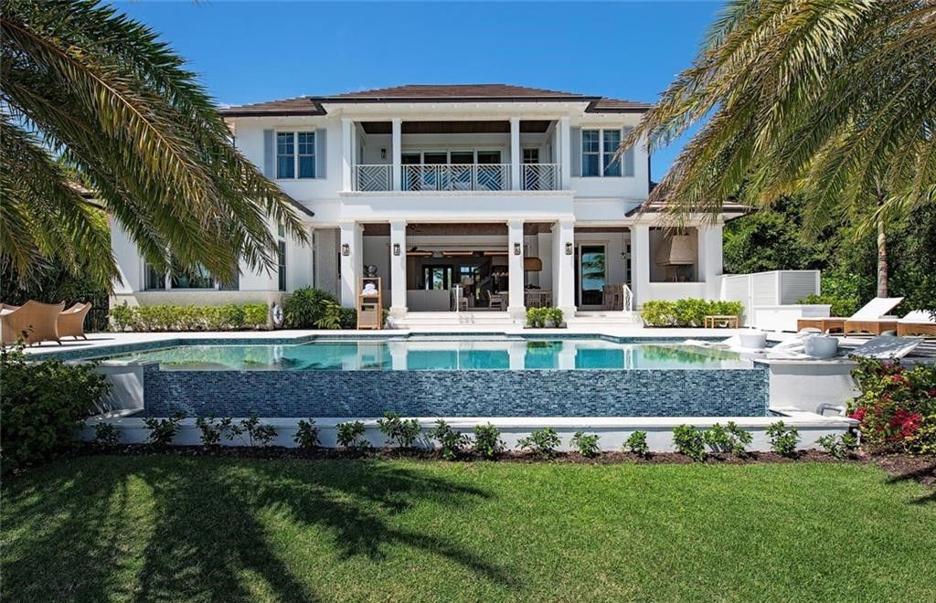 This exquisite 2022-built home offers breathtaking Doubloon Bay views and exclusive Cutlass Cove beach access.