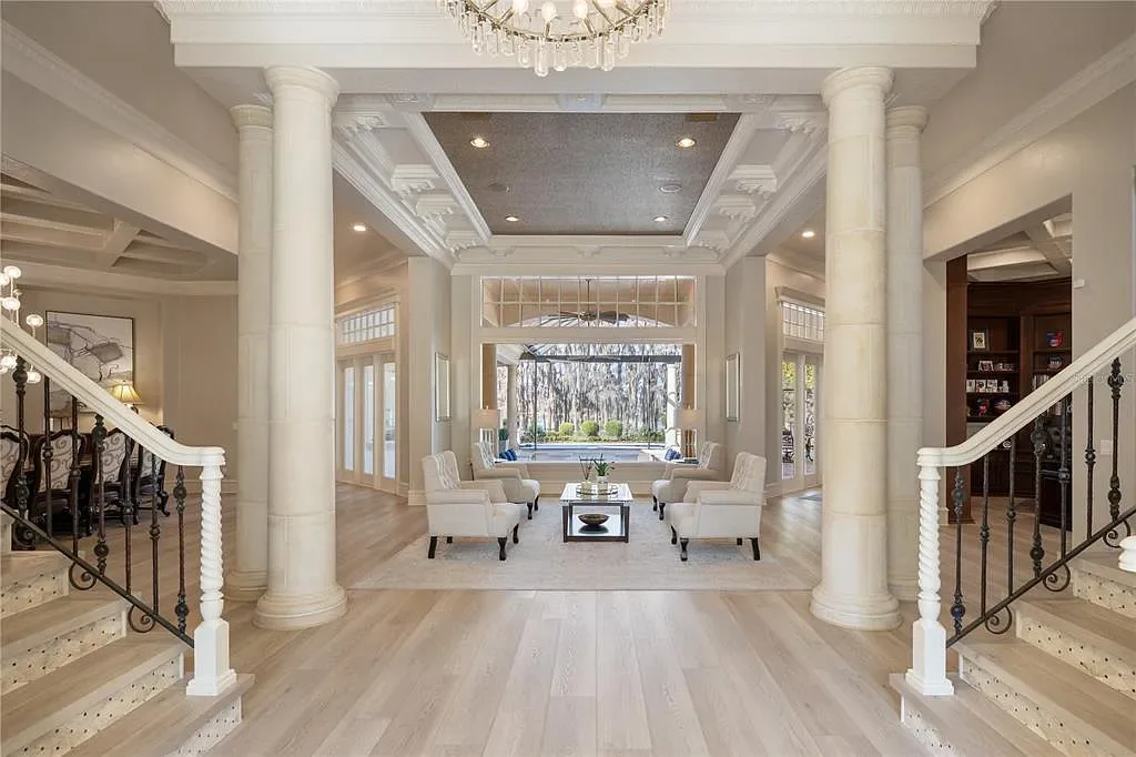 A state-of-the-art kitchen at 6126 Kirkstone Ln, designed with marble countertops, a large center island, and premium appliances.