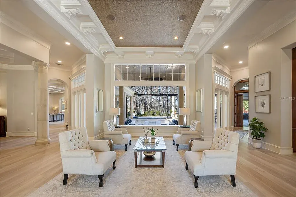 A state-of-the-art kitchen at 6126 Kirkstone Ln, designed with marble countertops, a large center island, and premium appliances.