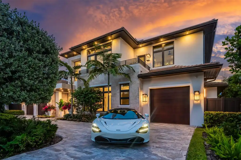 A panoramic view of 70 Isla Bahia Dr, a $23 million waterfront masterpiece in Fort Lauderdale luxury real estate, showcasing sleek modern architecture and expansive coastal views.