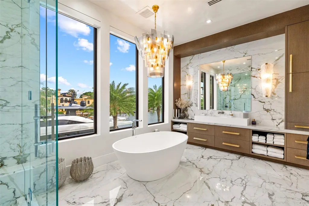 A panoramic view of 70 Isla Bahia Dr, a $23 million waterfront masterpiece in Fort Lauderdale luxury real estate, showcasing sleek modern architecture and expansive coastal views.