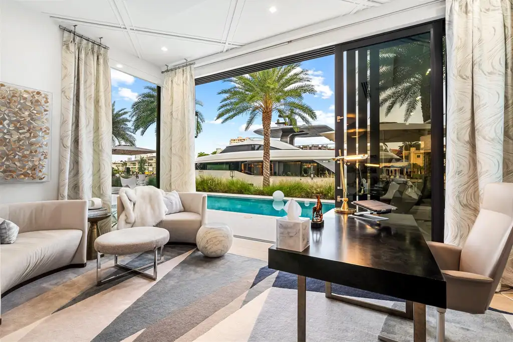 A panoramic view of 70 Isla Bahia Dr, a $23 million waterfront masterpiece in Fort Lauderdale luxury real estate, showcasing sleek modern architecture and expansive coastal views.