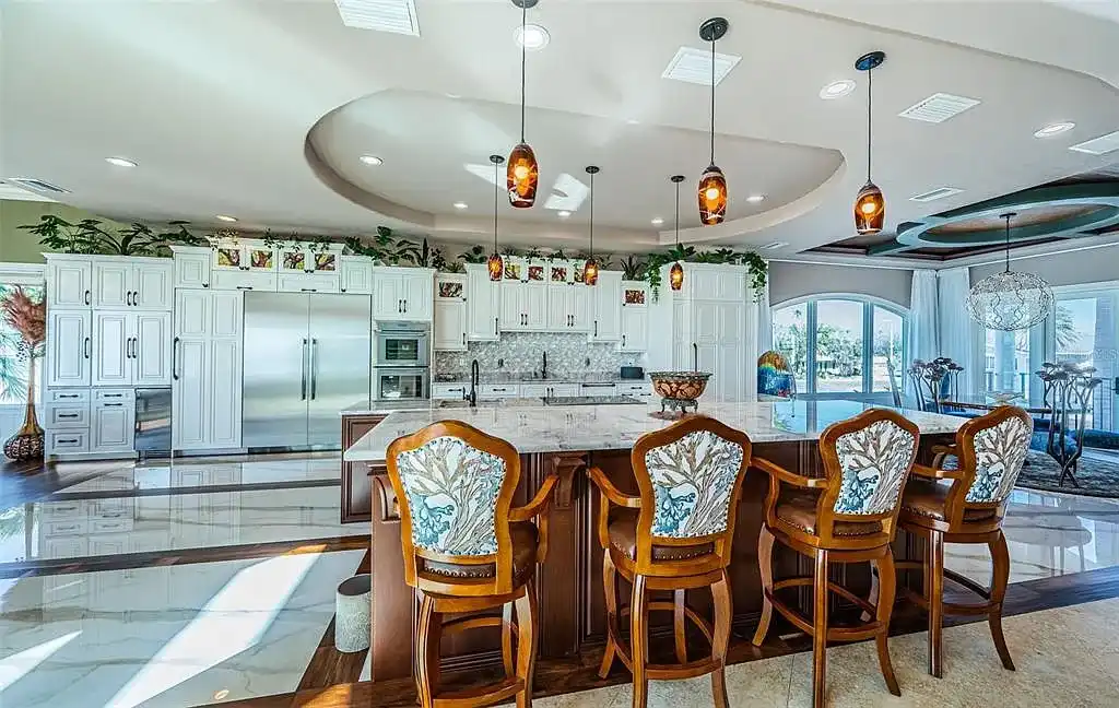 Built in 2014, this single-family residence stands on a 0.37-acre lot with 80 feet of pristine white sand beach frontage. The home’s architectural brilliance combines Tuscan coastal elements with modern craftsmanship, ensuring every detail is both aesthetically pleasing and functionally superior. With $1,532 per square foot, this estate is a testament to luxury living in Redington Beach real estate.