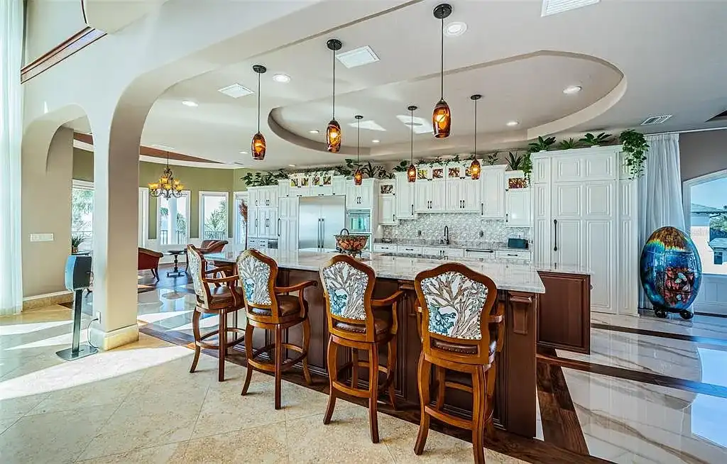 Built in 2014, this single-family residence stands on a 0.37-acre lot with 80 feet of pristine white sand beach frontage. The home’s architectural brilliance combines Tuscan coastal elements with modern craftsmanship, ensuring every detail is both aesthetically pleasing and functionally superior. With $1,532 per square foot, this estate is a testament to luxury living in Redington Beach real estate.