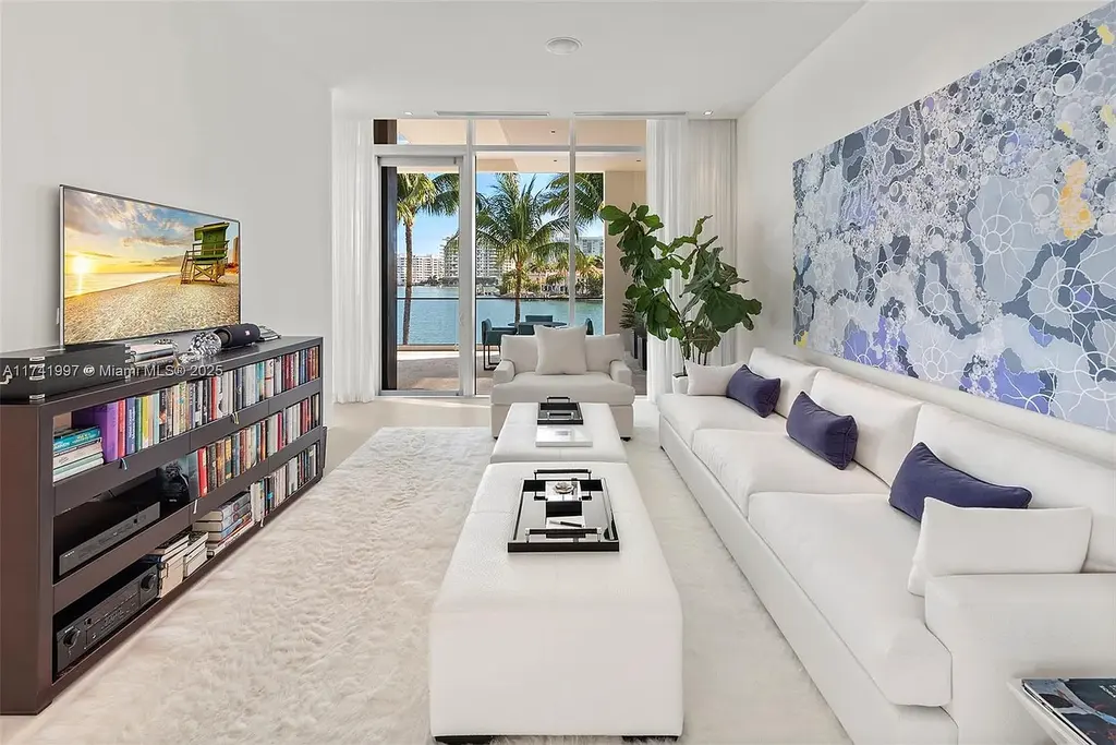 Exterior view of 88 La Gorce Cir, a $88M waterfront luxury estate in Miami Beach, showcasing modern architecture, a Guggenheim-inspired staircase, and breathtaking bay views.