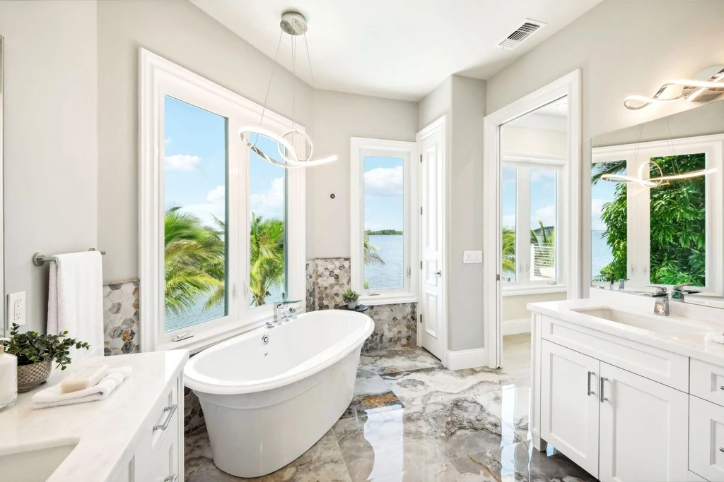 Stunning riverfront view of 526 Point Lane, showcasing the luxurious $6.5M Vero Beach home with expansive outdoor living spaces and panoramic water views, epitomizing Vero Beach real estate elegance.