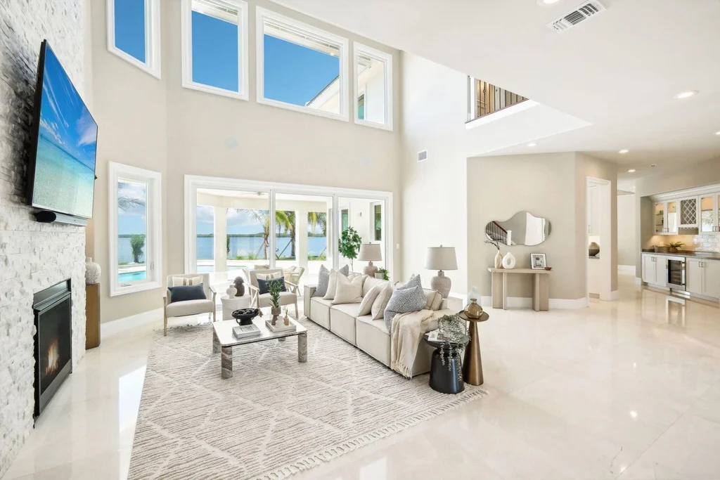 Stunning riverfront view of 526 Point Lane, showcasing the luxurious $6.5M Vero Beach home with expansive outdoor living spaces and panoramic water views, epitomizing Vero Beach real estate elegance.