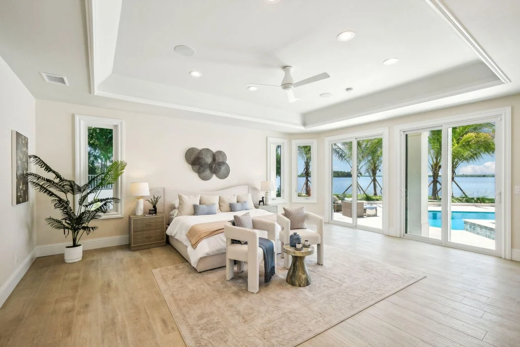 Stunning riverfront view of 526 Point Lane, showcasing the luxurious $6.5M Vero Beach home with expansive outdoor living spaces and panoramic water views, epitomizing Vero Beach real estate elegance.