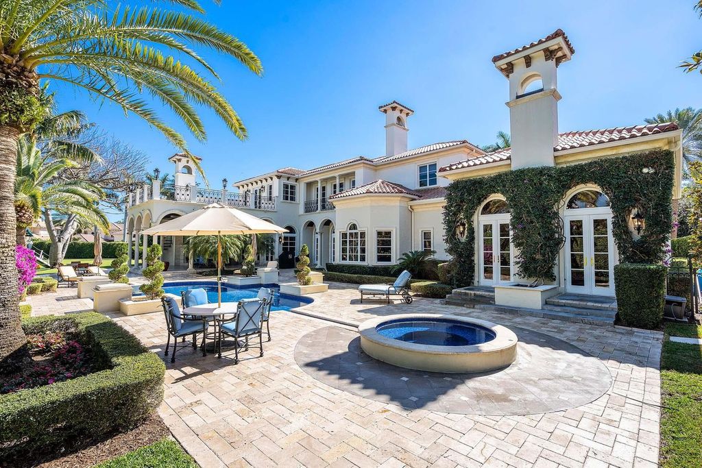 1869 Sabal Palm Drive, an ultra-luxury home in Boca Raton, offers prime golf course frontage and world-class amenities in a prestigious real estate enclave.