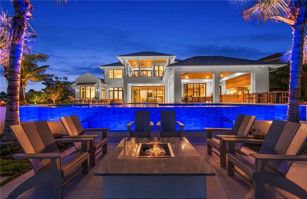 Discover the ultimate waterfront lifestyle in this exquisite Aqualane Shores estate. Set on a .37-acre corner lot with 225 feet of water frontage and coveted southwest rear exposure for breathtaking sunsets and Gulf access, this 6,603 square feet masterpiece (built in 2025) offers 5 bedrooms, 7 baths, and luxurious details throughout.