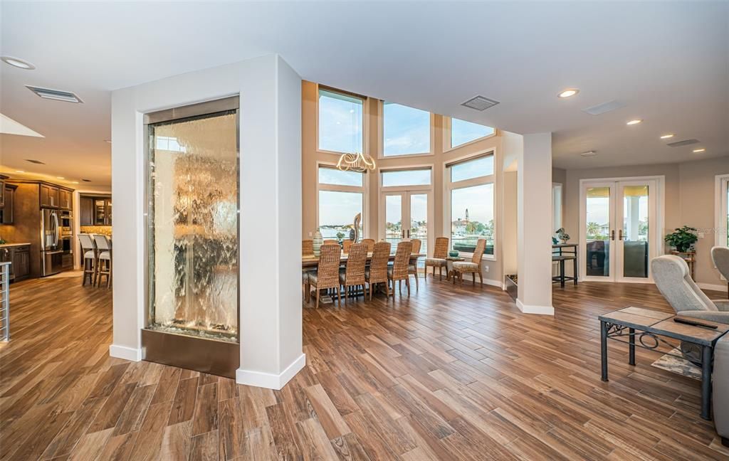 Built in 2018, this smart-home features soaring ceilings, sleek contemporary finishes, and breathtaking water views. The gourmet kitchen boasts quartz countertops, custom cabinetry, a Bosch cooking center, and a butler’s pantry.