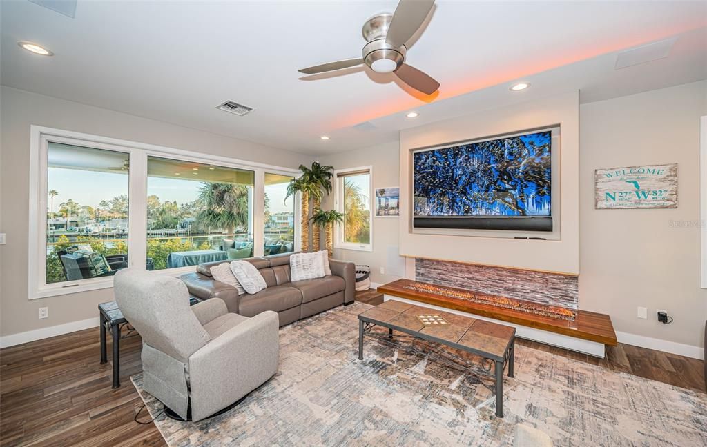 Built in 2018, this smart-home features soaring ceilings, sleek contemporary finishes, and breathtaking water views. The gourmet kitchen boasts quartz countertops, custom cabinetry, a Bosch cooking center, and a butler’s pantry.