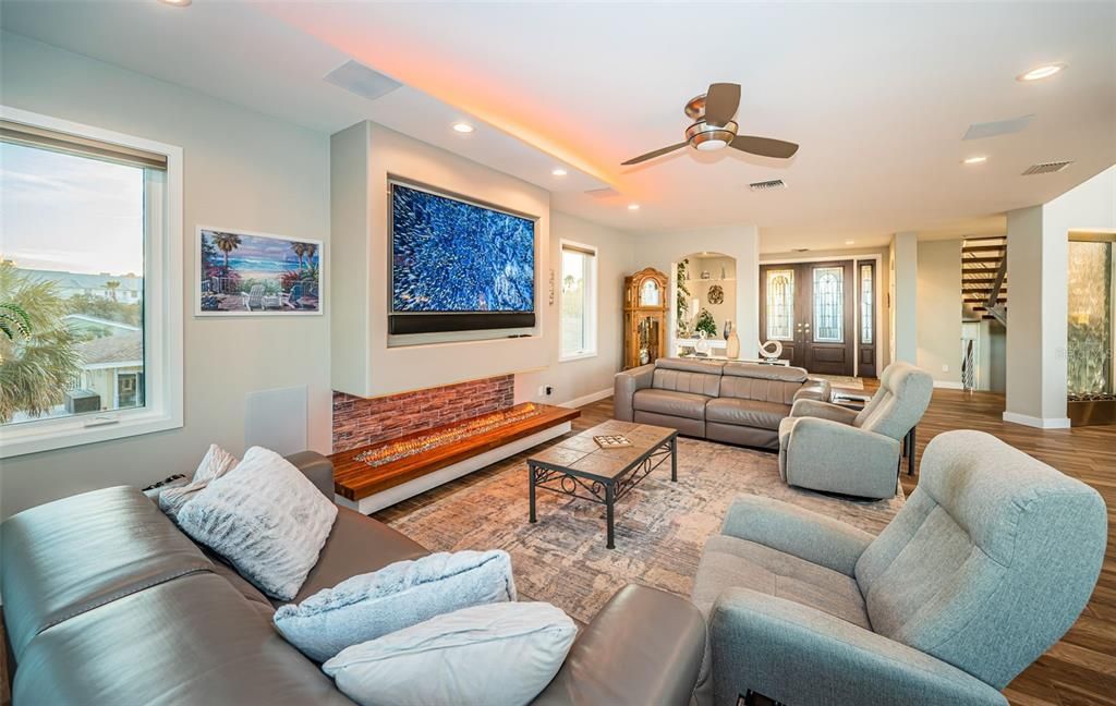 Built in 2018, this smart-home features soaring ceilings, sleek contemporary finishes, and breathtaking water views. The gourmet kitchen boasts quartz countertops, custom cabinetry, a Bosch cooking center, and a butler’s pantry.