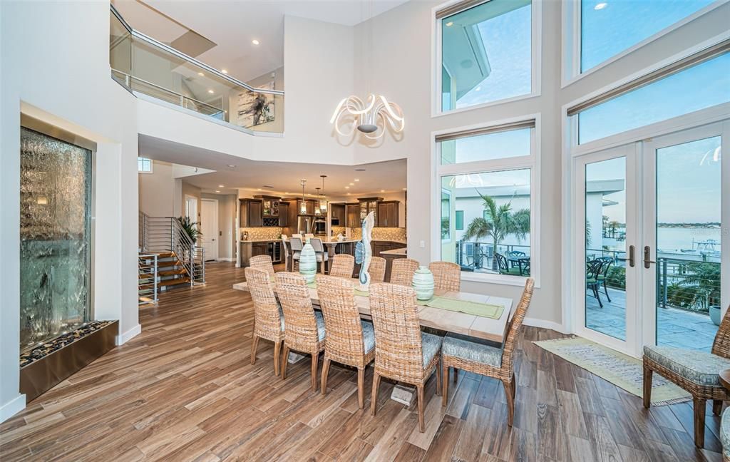 Built in 2018, this smart-home features soaring ceilings, sleek contemporary finishes, and breathtaking water views. The gourmet kitchen boasts quartz countertops, custom cabinetry, a Bosch cooking center, and a butler’s pantry.