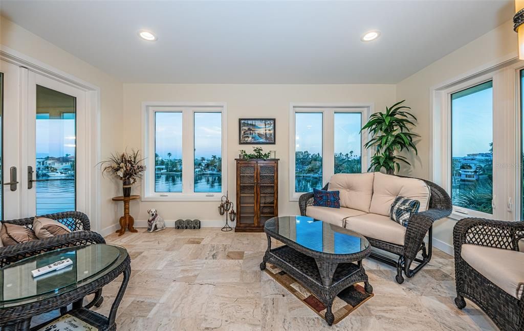 Built in 2018, this smart-home features soaring ceilings, sleek contemporary finishes, and breathtaking water views. The gourmet kitchen boasts quartz countertops, custom cabinetry, a Bosch cooking center, and a butler’s pantry.