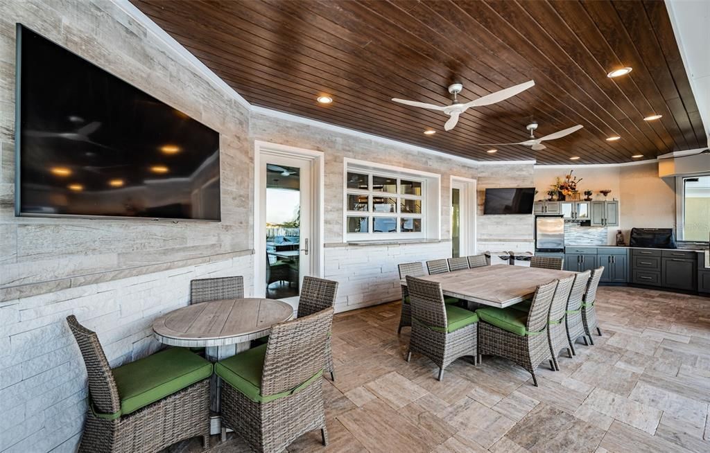 Built in 2018, this smart-home features soaring ceilings, sleek contemporary finishes, and breathtaking water views. The gourmet kitchen boasts quartz countertops, custom cabinetry, a Bosch cooking center, and a butler’s pantry.