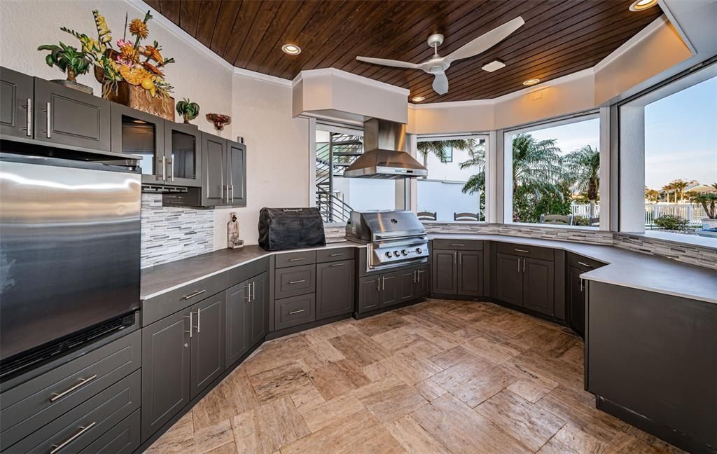 Built in 2018, this smart-home features soaring ceilings, sleek contemporary finishes, and breathtaking water views. The gourmet kitchen boasts quartz countertops, custom cabinetry, a Bosch cooking center, and a butler’s pantry.