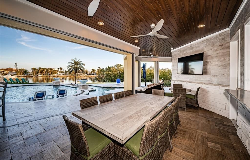 Built in 2018, this smart-home features soaring ceilings, sleek contemporary finishes, and breathtaking water views. The gourmet kitchen boasts quartz countertops, custom cabinetry, a Bosch cooking center, and a butler’s pantry.