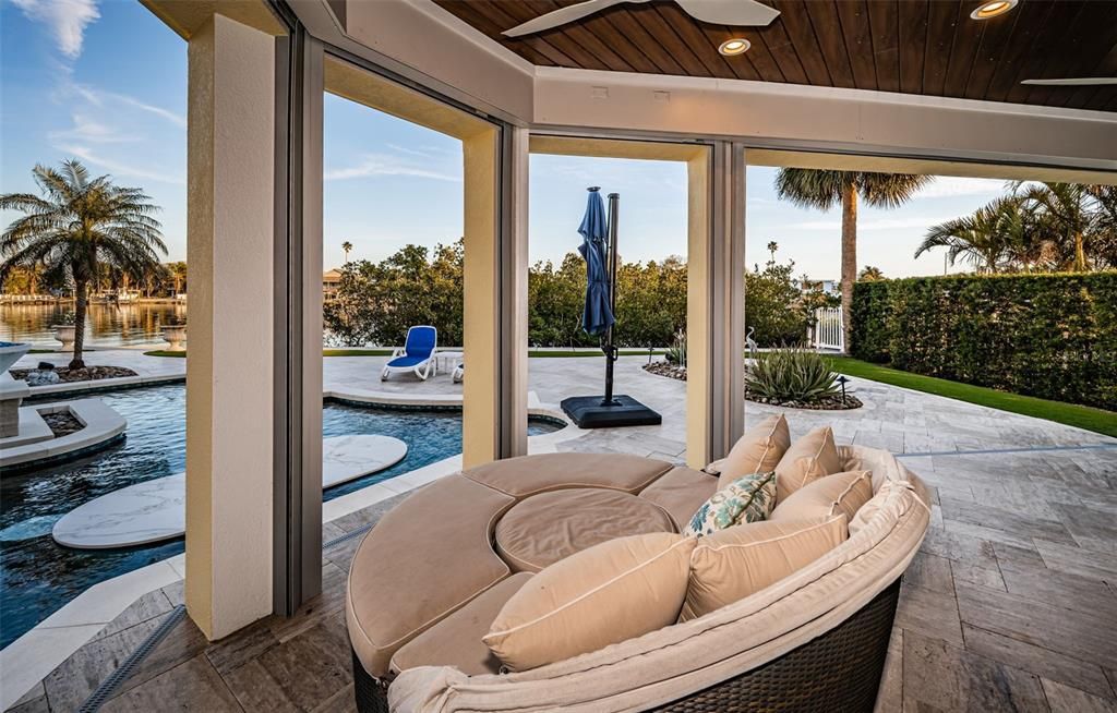 Built in 2018, this smart-home features soaring ceilings, sleek contemporary finishes, and breathtaking water views. The gourmet kitchen boasts quartz countertops, custom cabinetry, a Bosch cooking center, and a butler’s pantry.