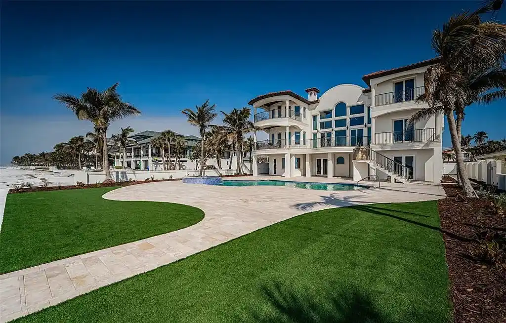 Built in 2014, this single-family residence stands on a 0.37-acre lot with 80 feet of pristine white sand beach frontage. The home’s architectural brilliance combines Tuscan coastal elements with modern craftsmanship, ensuring every detail is both aesthetically pleasing and functionally superior. With $1,532 per square foot, this estate is a testament to luxury living in Redington Beach real estate.