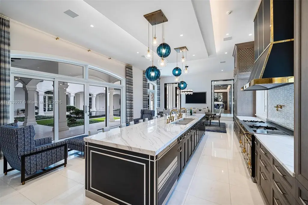 Grand entrance of the $32M estate at 14851 SW 21st St, showcasing synchronized fountains, landscaped gardens, and a resort-style pool house.