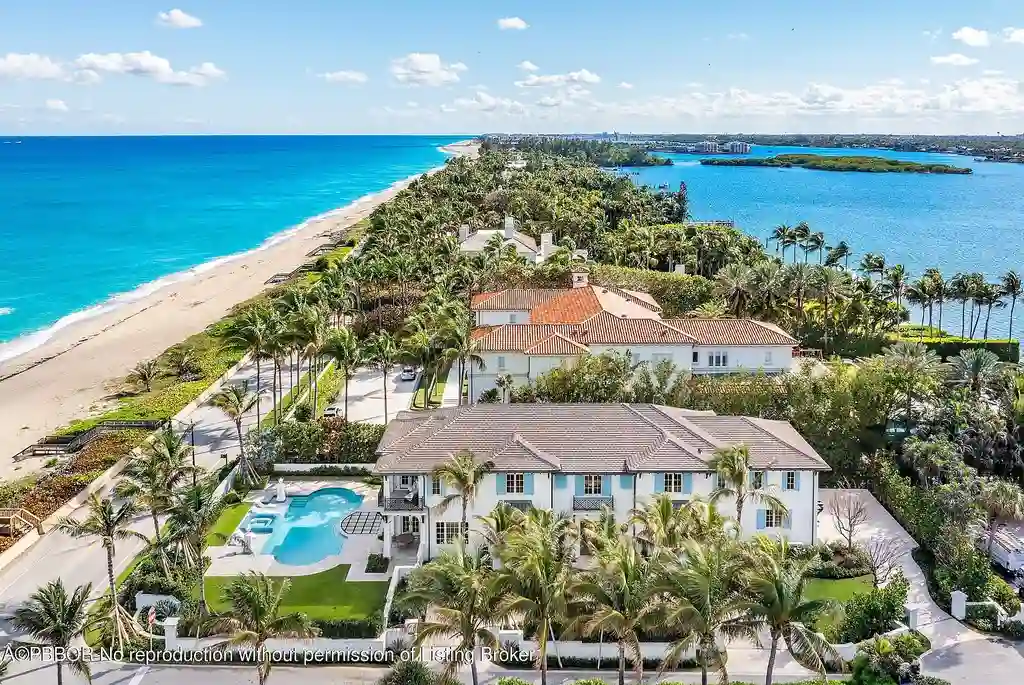 Stunning oceanfront mansion at 1742 S Ocean Blvd, Palm Beach, featuring resort-style pool, panoramic Atlantic views, and luxury interiors.