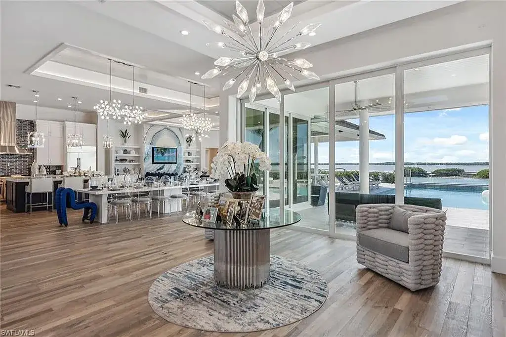 Stunning waterfront estate at 1829 S Inlet Dr, Marco Island, featuring a contemporary coastal design with panoramic Gulf views and lush tropical landscaping.